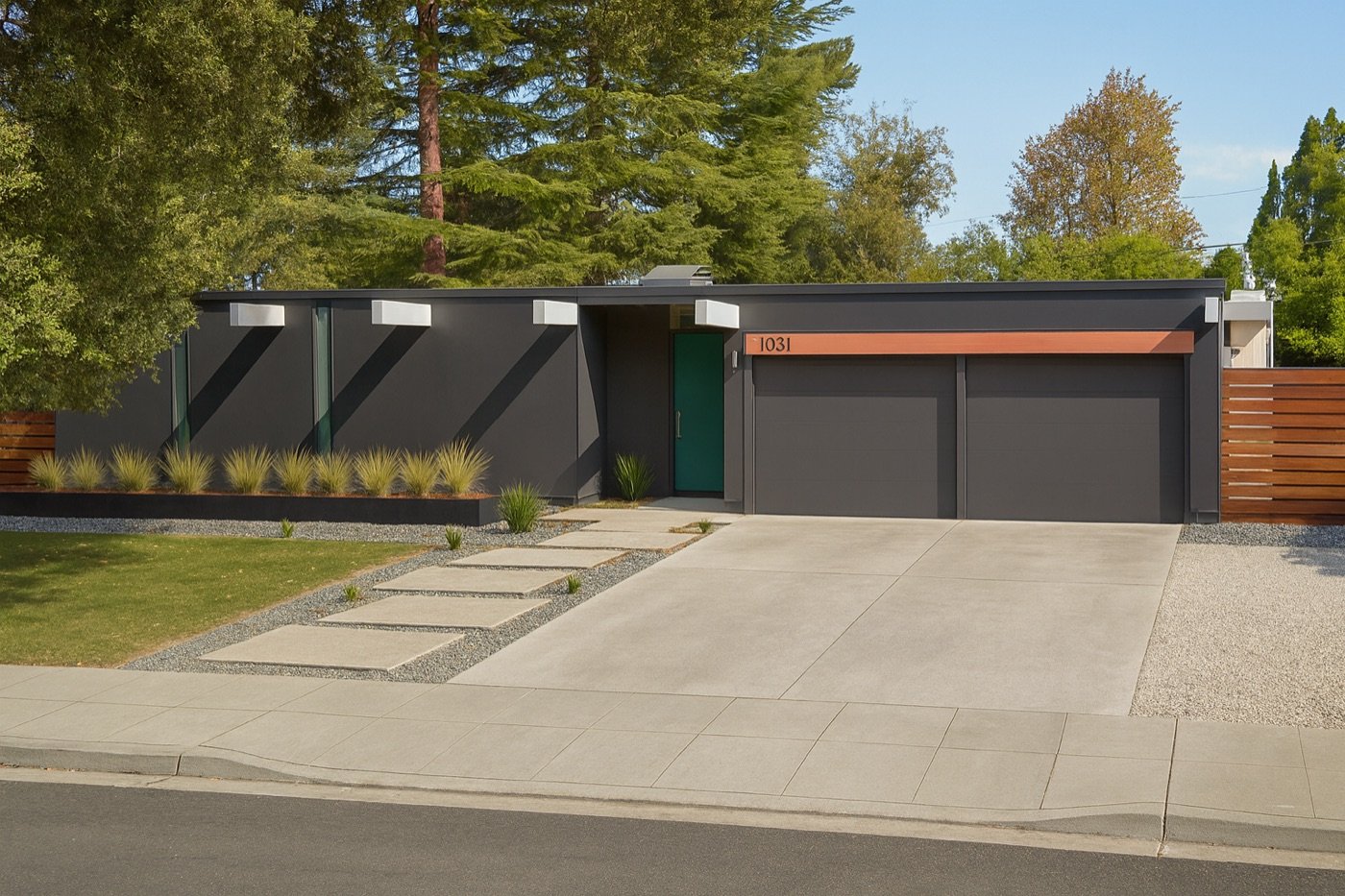 Fairorchard-area Eichler — charcoal siding, teal door